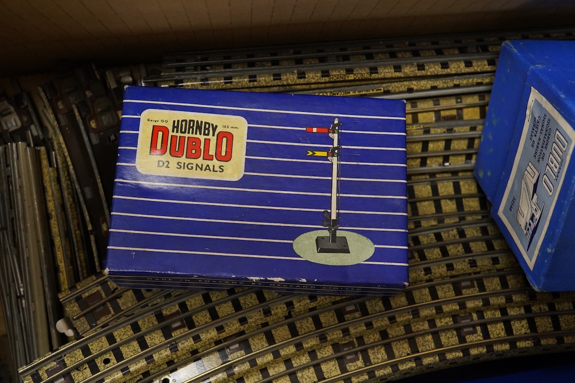 A collection of Hornby Dublo railway for 3-rail running, including two locomotives; an LMS Duchess of Athol 4-6-2, locomotive box, tender unboxed, and a boxed BR Standard Class 4 2-6-4T, 80054, together with five boxed b